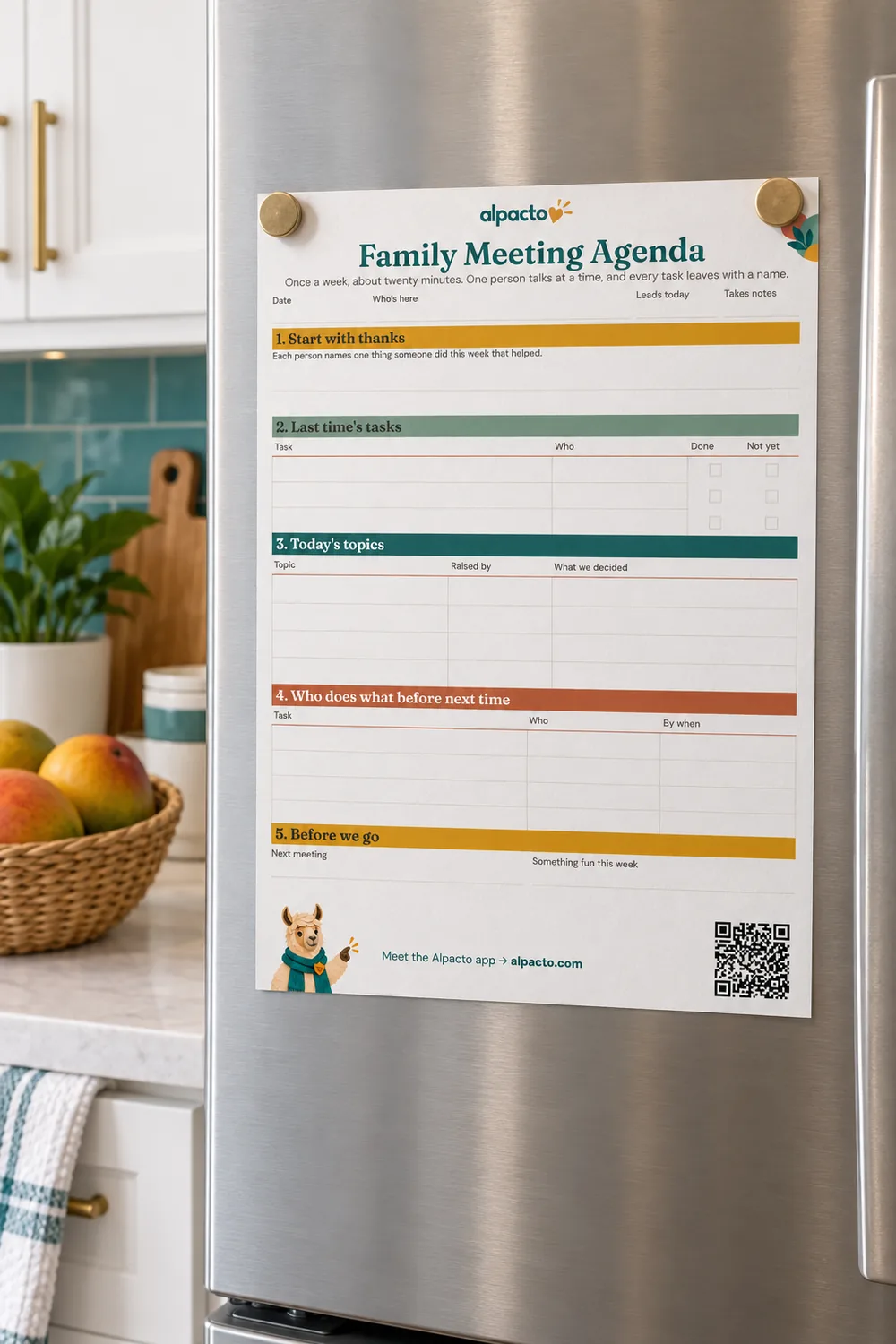 A blank family meeting agenda printable held by magnets on a stainless fridge, a basket of fruit on the counter below.