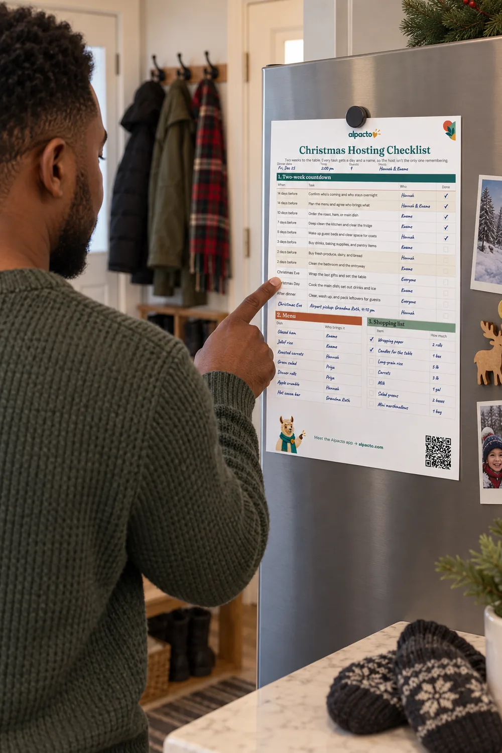A man points to the filled-in Christmas hosting checklist on a steel fridge, a name in the Who box of every row.