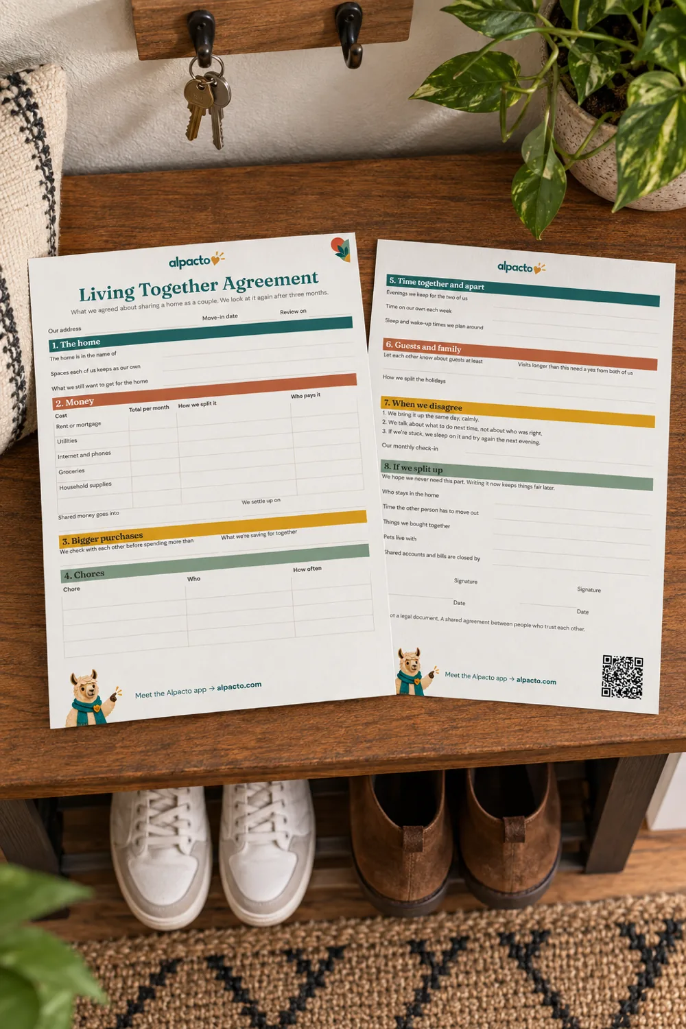 Both blank pages of the living together agreement, color design, on an entryway bench under a key hook, with shoes on the rack below.