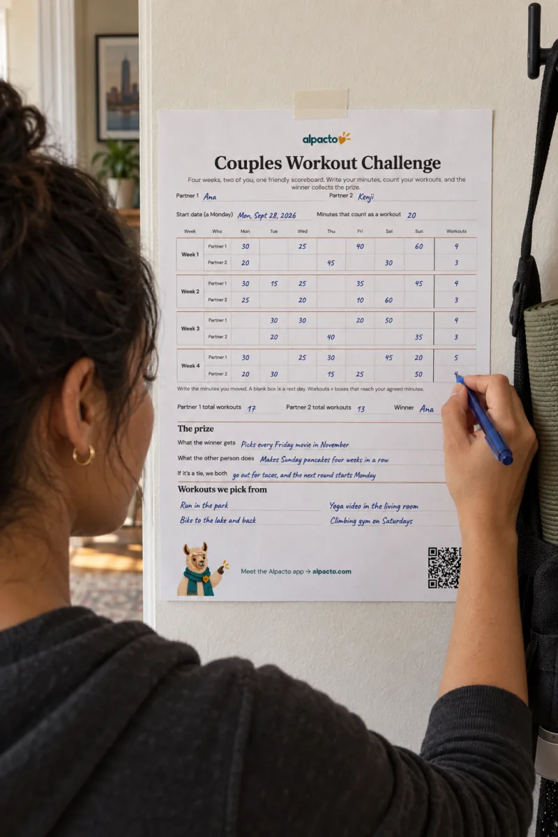 A woman in a hallway writing 4 in the Workouts column of a filled-in scoreboard taped to the wall